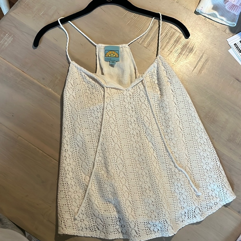 Nice white top. Lacey material. C&C California brand. Never worn.